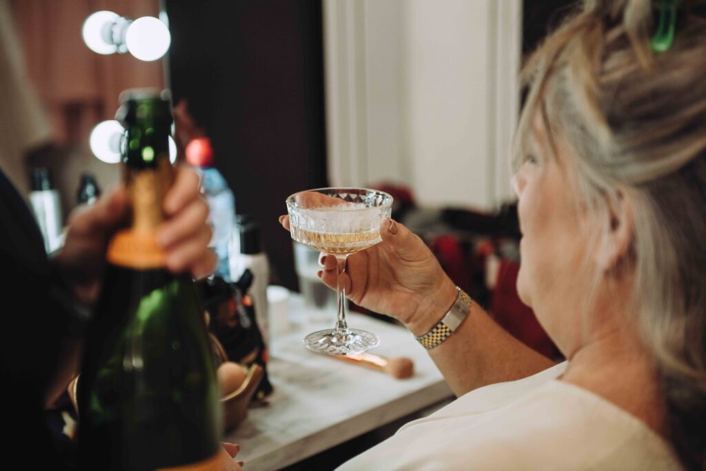 Cheers at this high-end wedding with champagne